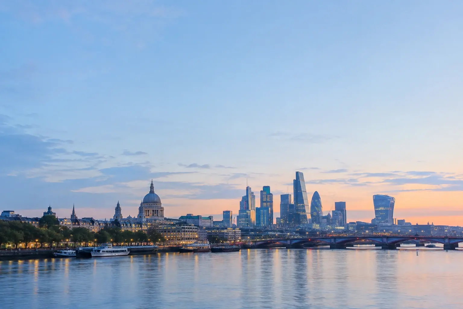 The City of London skyline and St Paul's Cathedral across the Thames at dawn